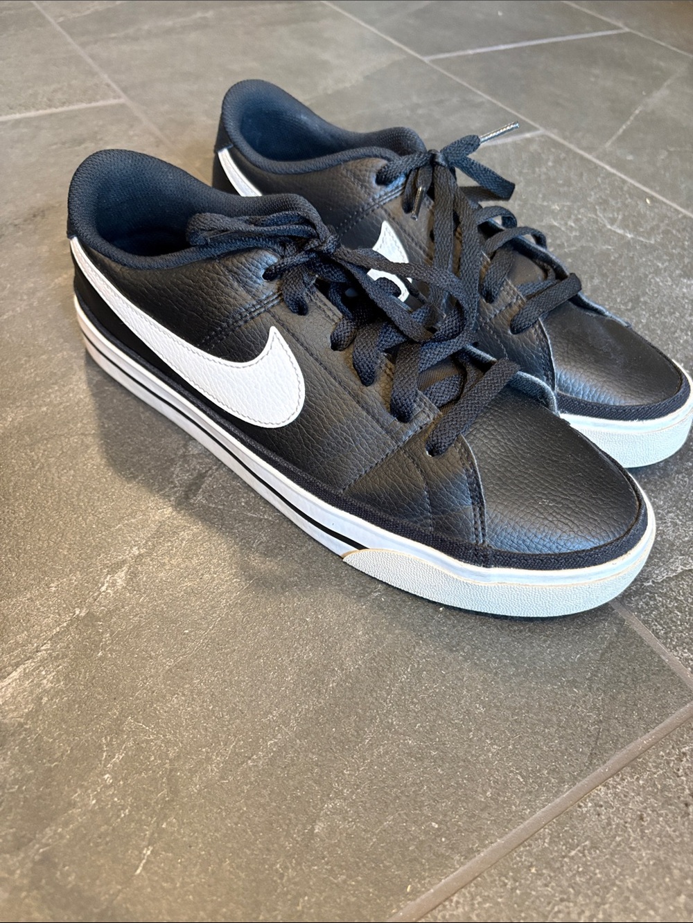 Nike Men’s Black Leather Sneakers with White Swoosh